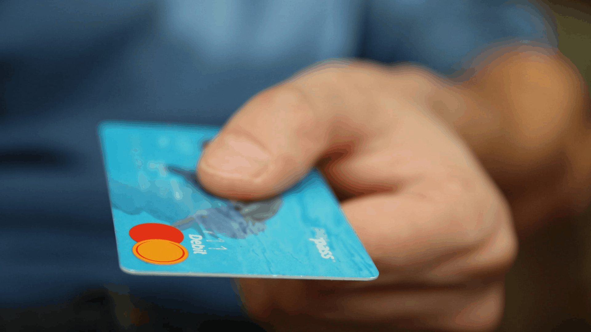 hand holding credit card