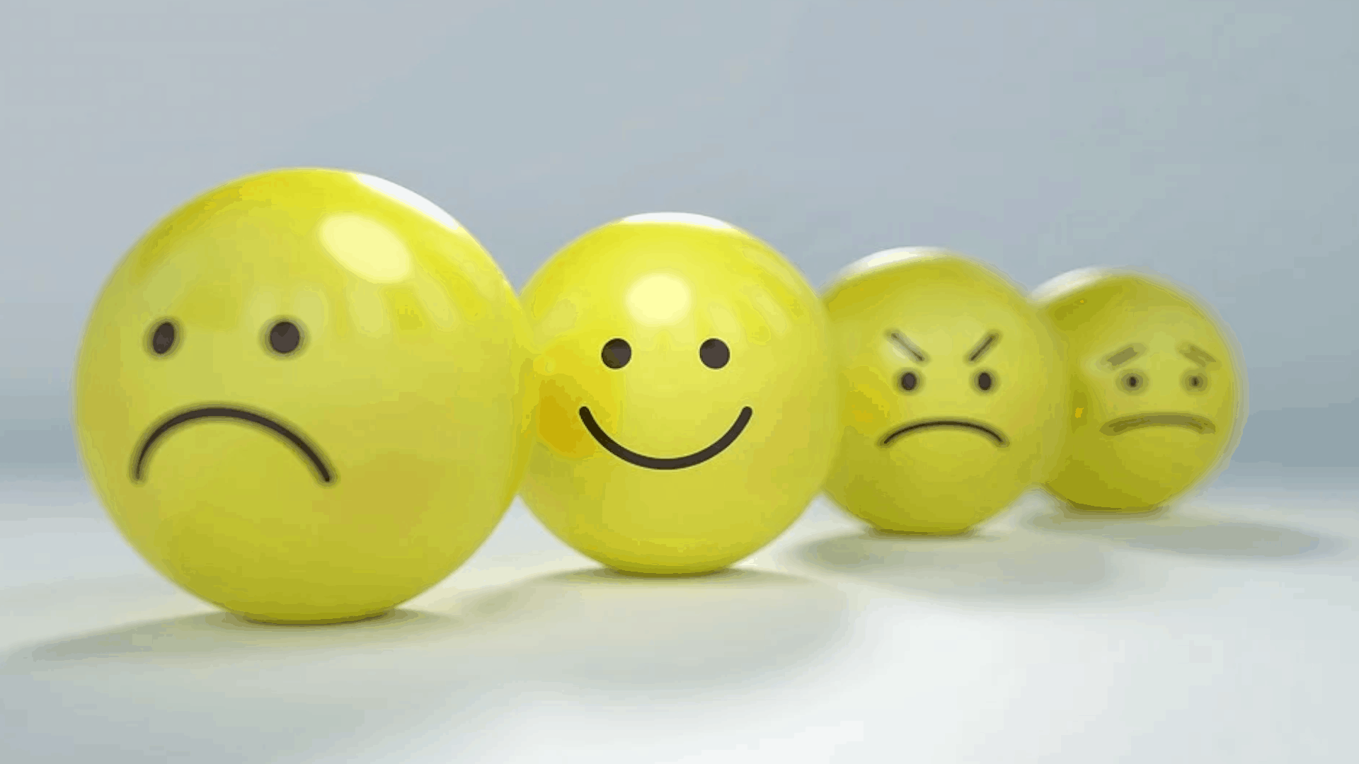 yellow balls with emotions